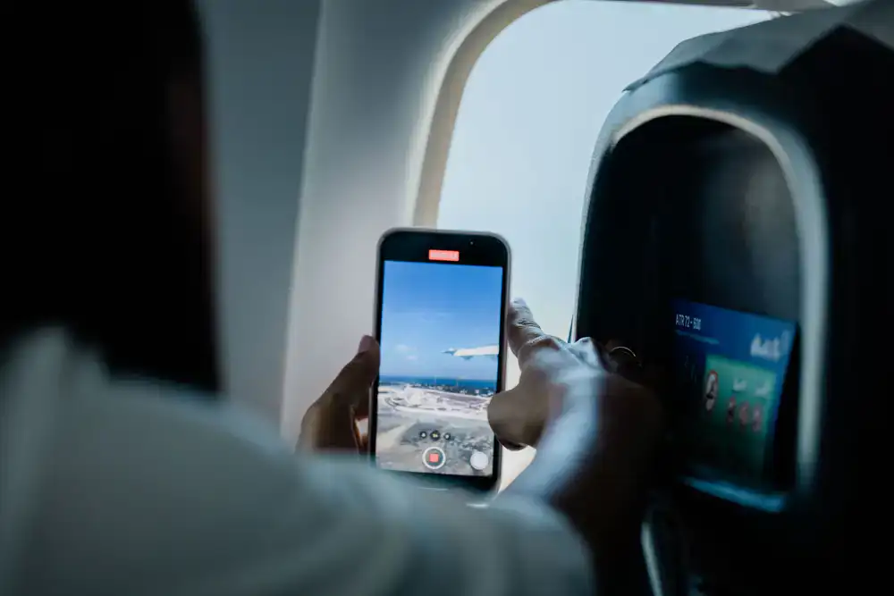 Realistic mobile flight simulator on a smartphone screen against a clear sky